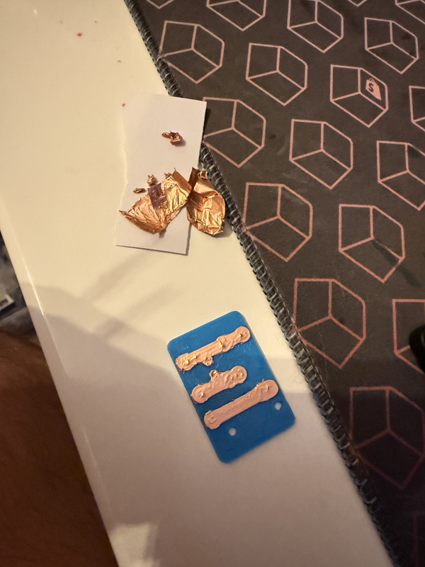 Carefully applying and cutting copper tape