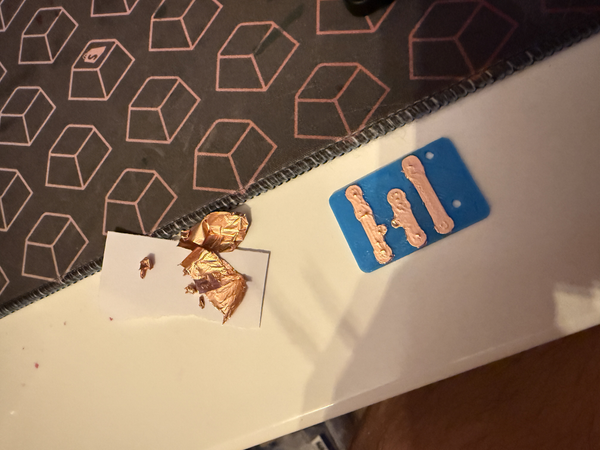 Carefully applying and cutting copper tape
